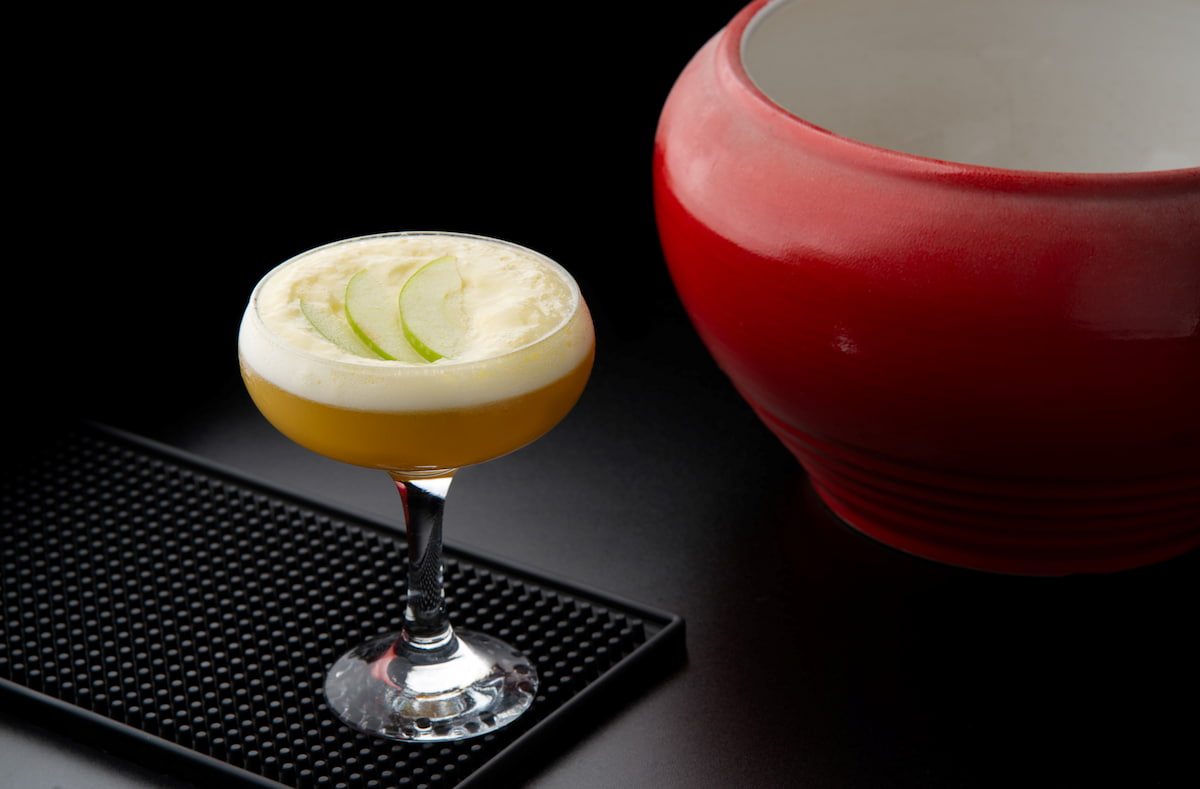 Cocktail with mango and lime foam