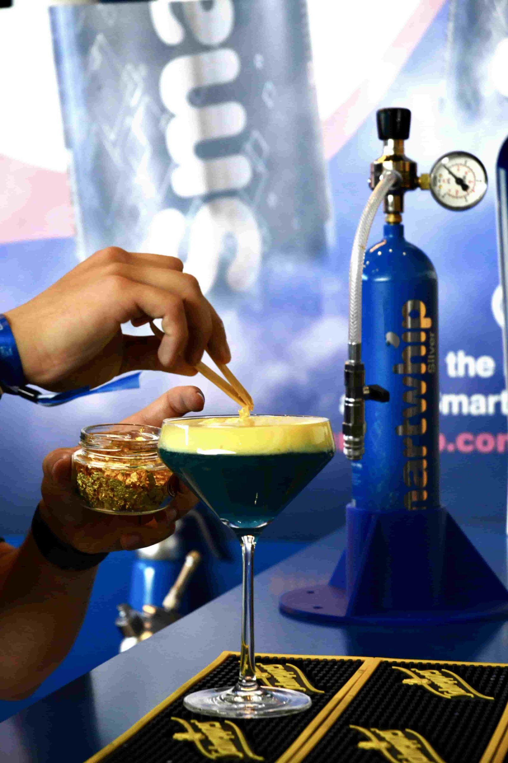 Smartwhip molecular cocktail gold over blue